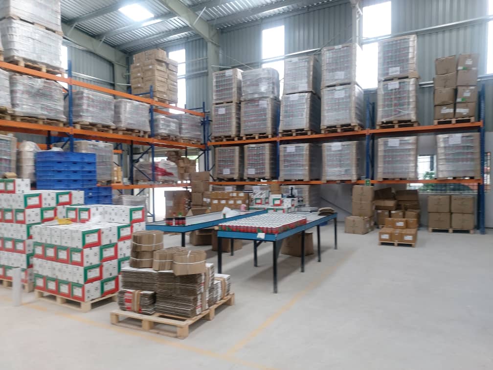 Packaged products and pallets on warehouse storage racks